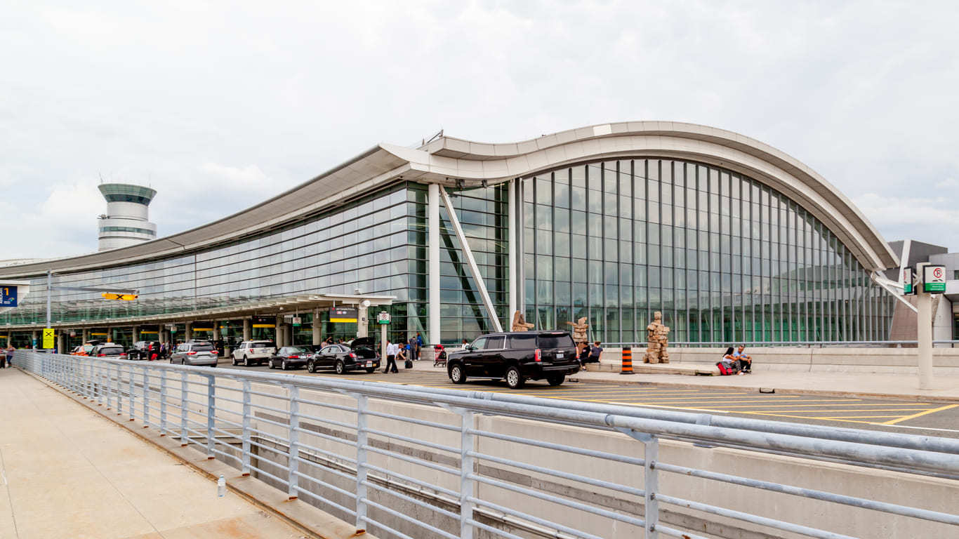 The sleek terminal exterior of Toronto Pearson International Airport highlights its modern architecture and welcoming design.