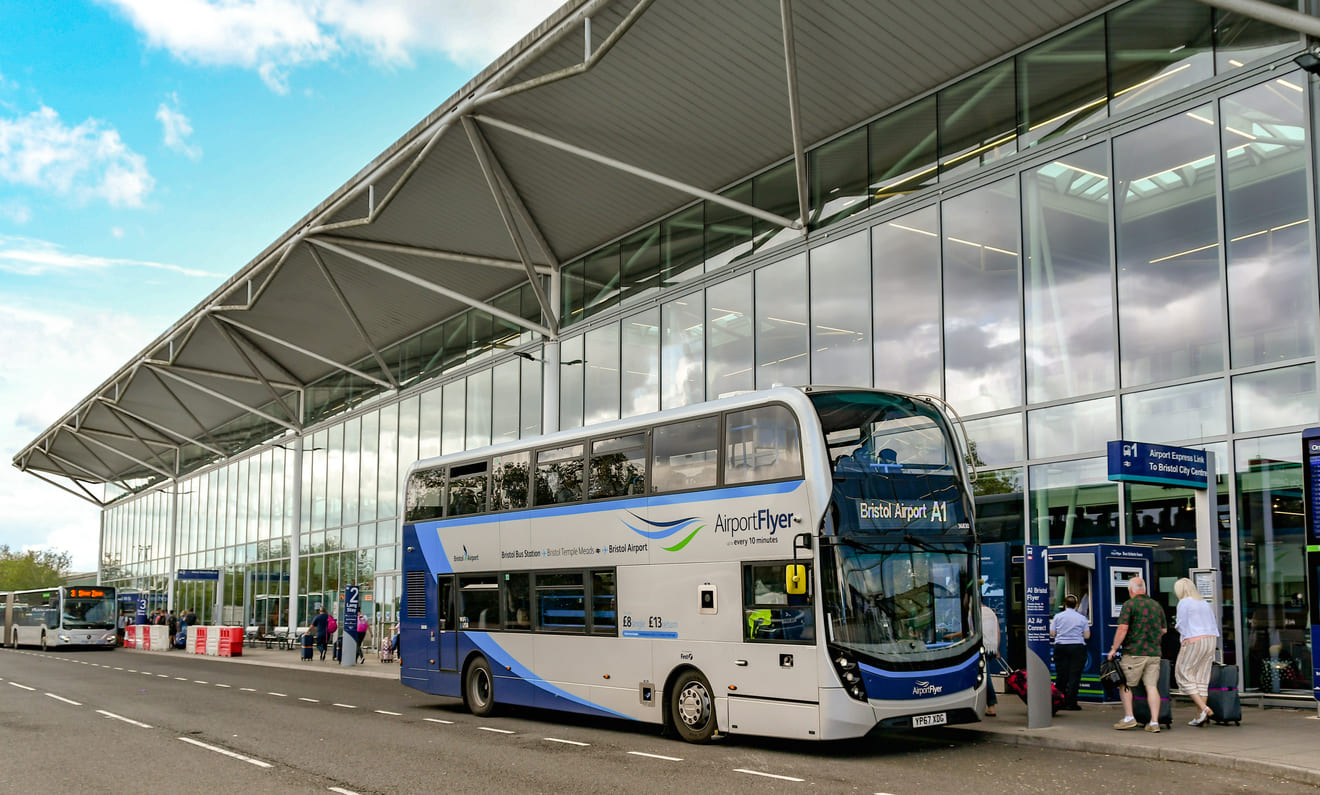 Bristol Airport's sleek terminal exterior features the Airport Flyer bus, providing convenient transport to the city center.