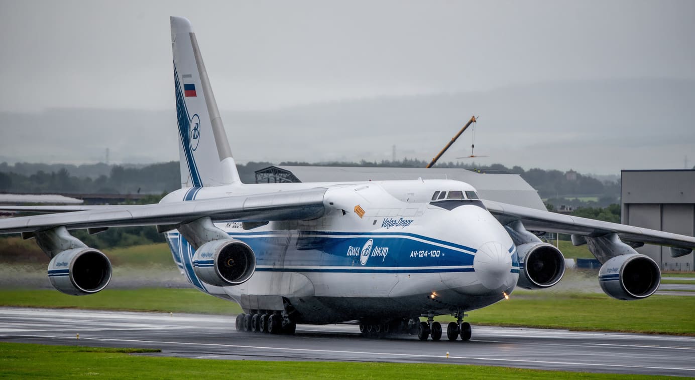 A massive Antonov An-124 cargo plane on the runway at Glasgow Prestwick Airport.