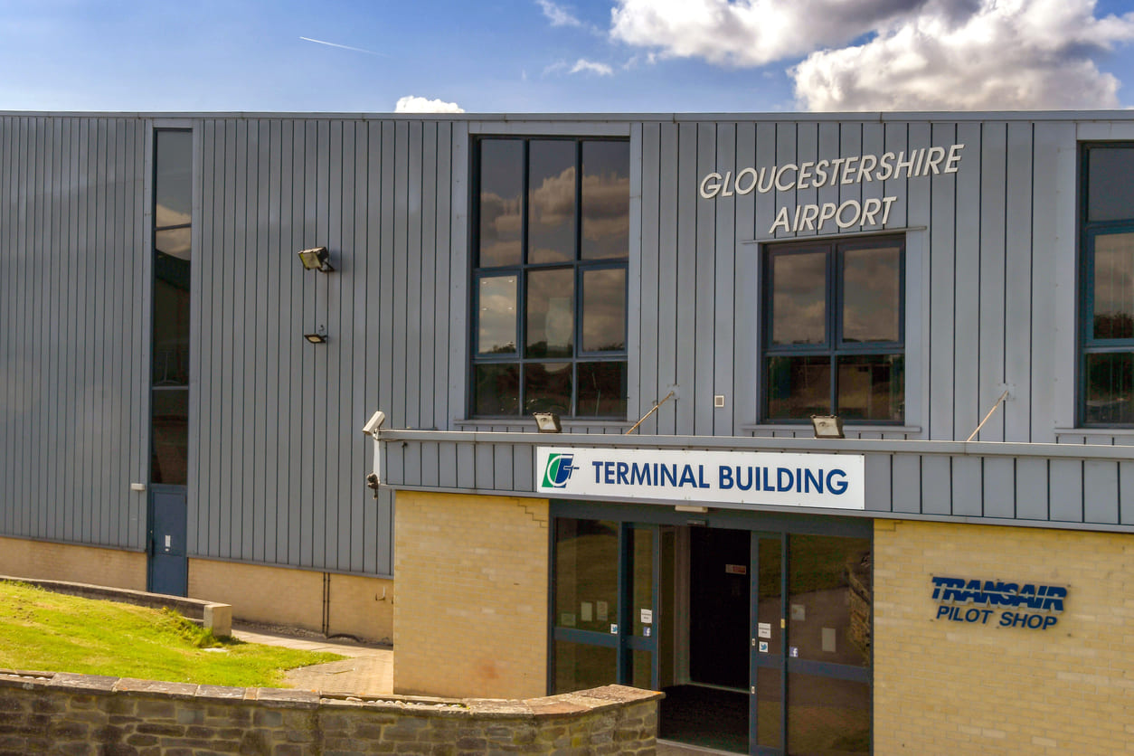 The terminal building of Gloucestershire Airport, showcasing its role as a regional hub for aviation and pilot training.