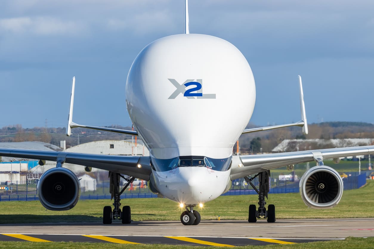 An Airbus Beluga XL on the runway at Hawarden Airport, showcasing its distinctive design and logistical importance.