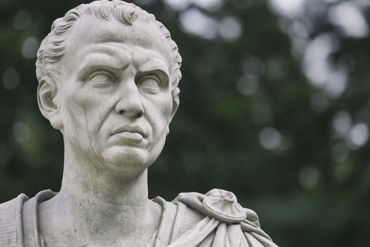 A detailed marble statue of Julius Caesar, commemorating his role in reforming the calendar with the Julian system.