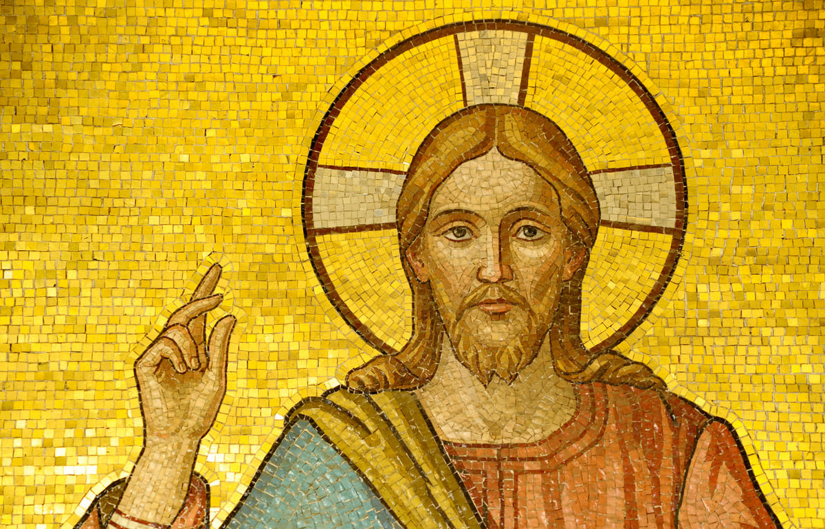 A golden mosaic of Jesus Christ with a halo, symbolizing divinity, ascension, and spiritual light.