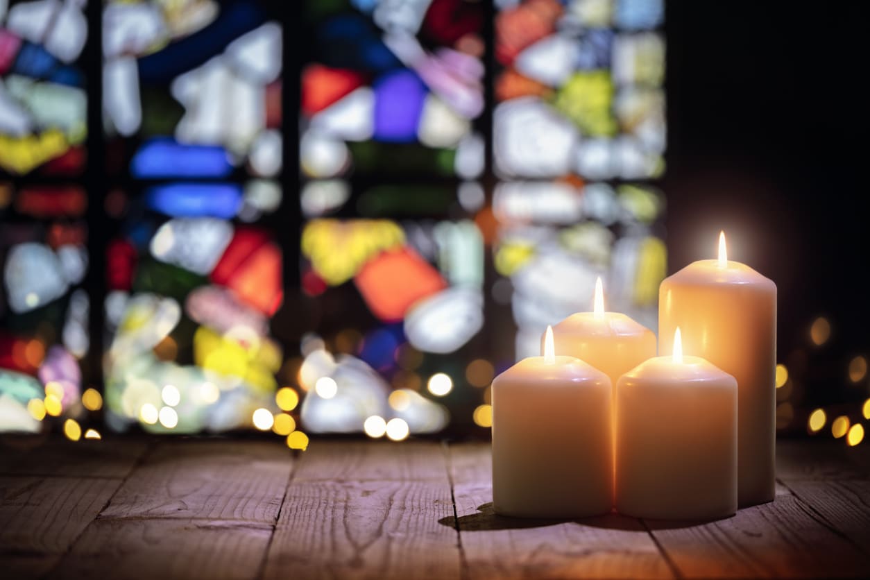 A serene display of glowing candles, symbolizing reflection and hope during Holy Saturday.