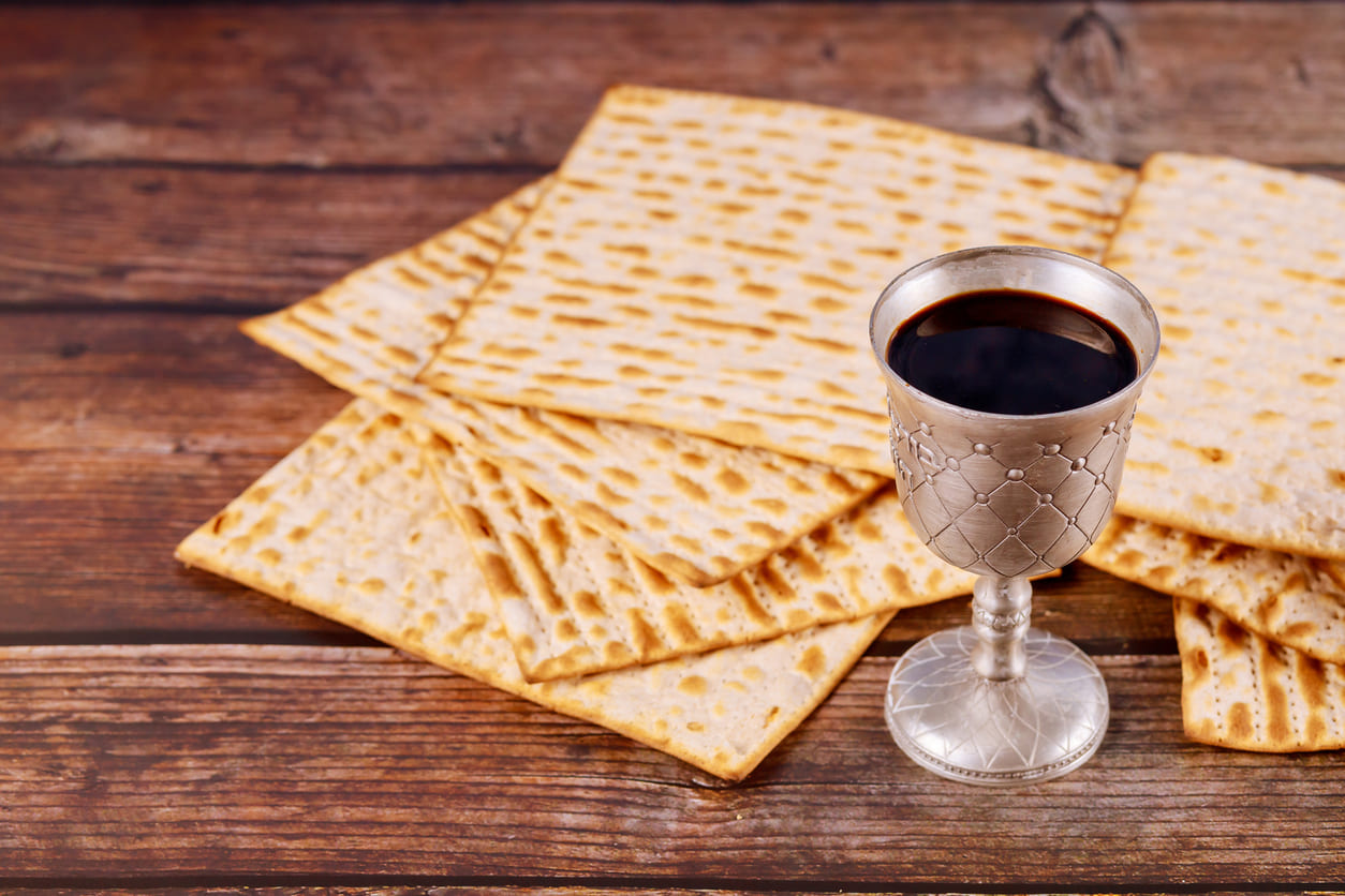 Matzah and a silver goblet of wine, essential elements of the Seder meal during Passover.