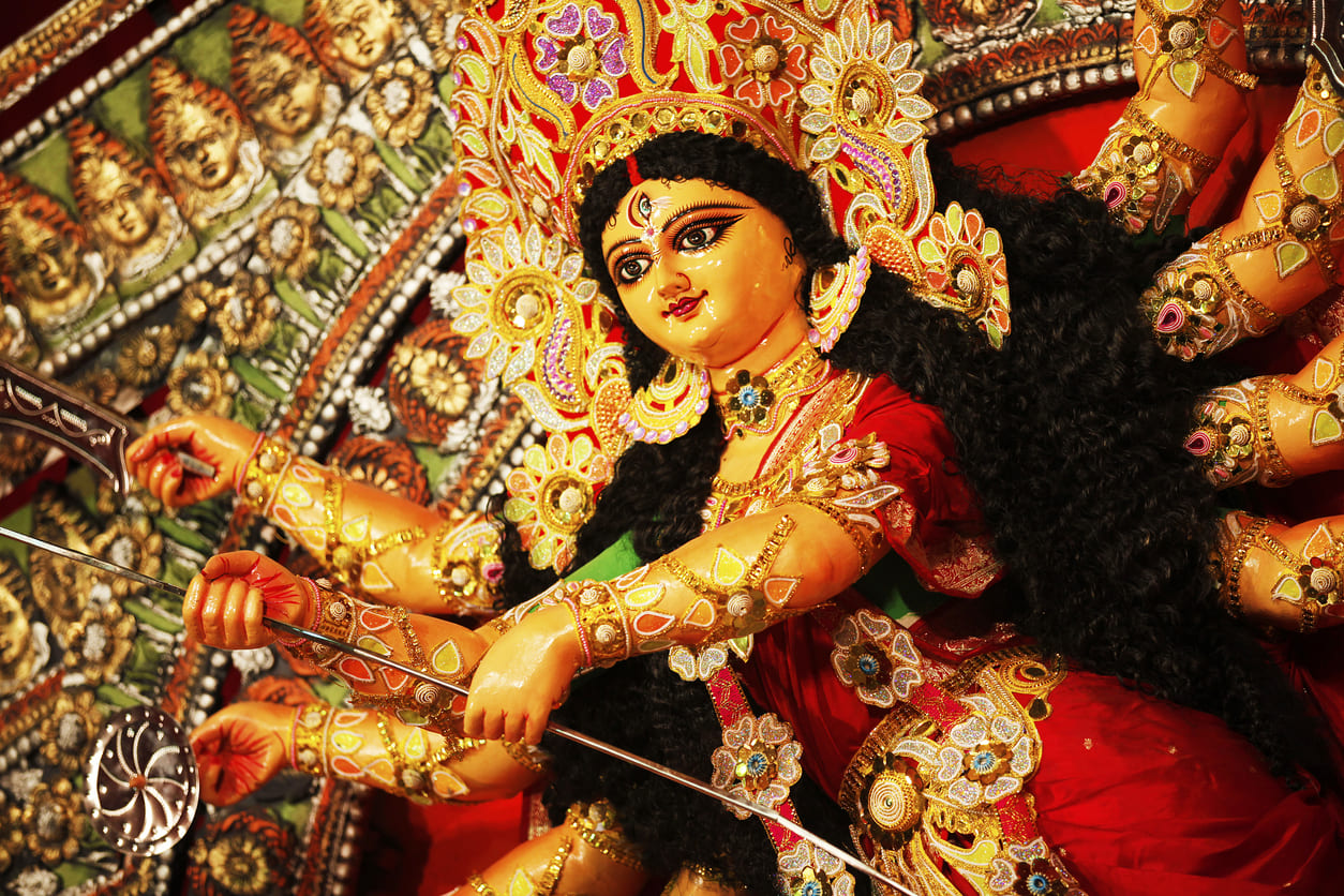 Goddess Durga adorned in vibrant ornaments, symbolizing her divine power celebrated on Maha Ashtami.