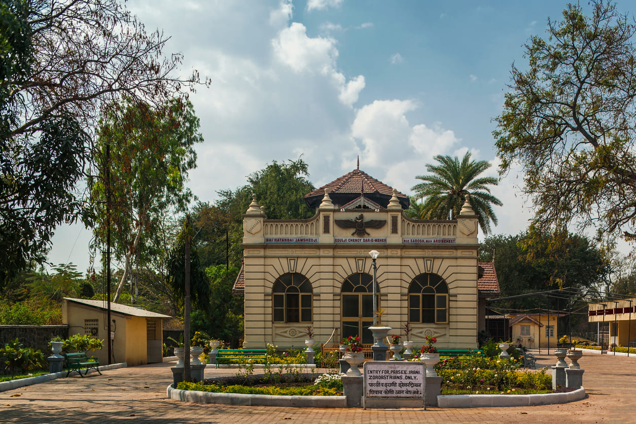 Zoroastrian fire temple in India, surrounded by a serene garden, reflecting its sacred and peaceful ambiance.