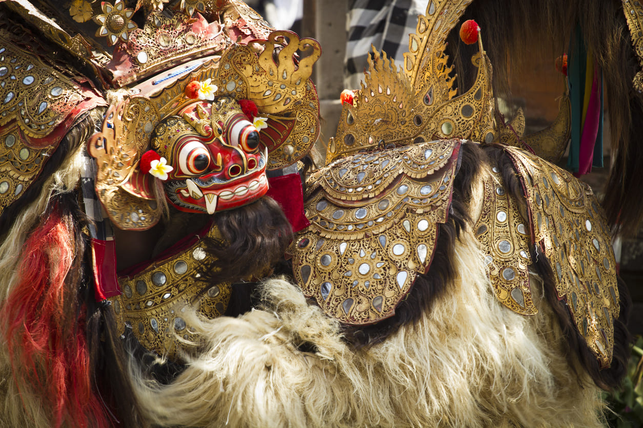 A vibrant Barong dancer in full traditional costume, showcasing Bali's rich cultural heritage during Hindu temple festivities.