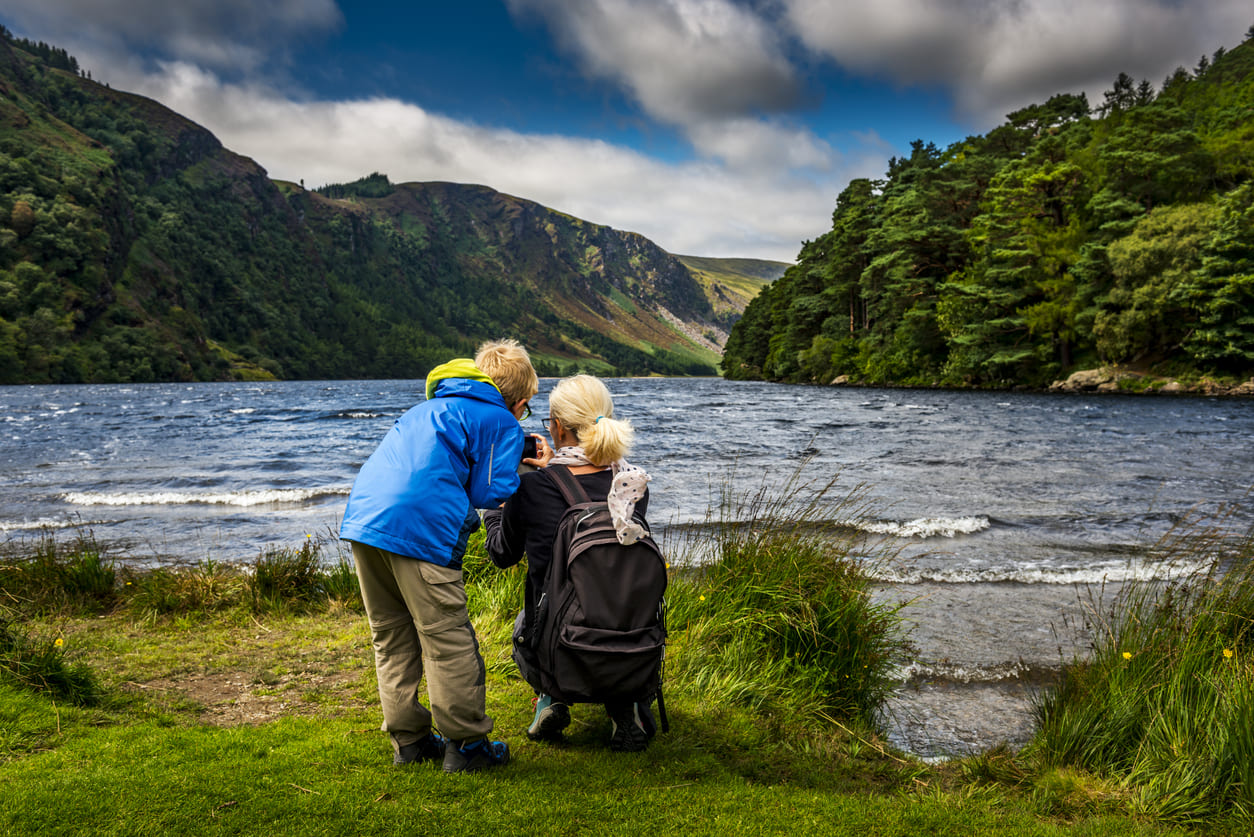 A picturesque lakeside in Ireland, capturing the serene and popular way of enjoying the August Bank Holiday outdoors.