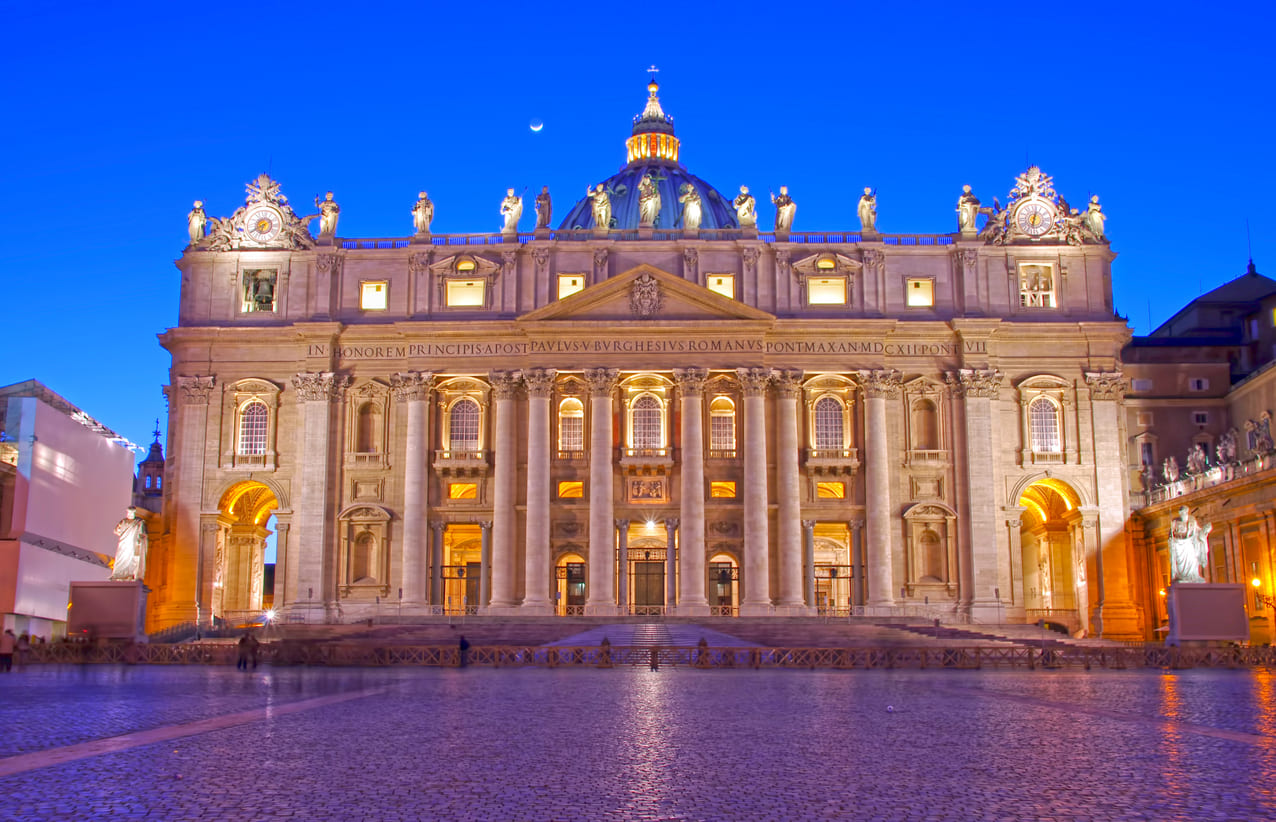 Beautifully lit St. Peter's Basilica in Vatican City, symbolizing its significance in the Feast of St. Peter and St. Paul celebrations.