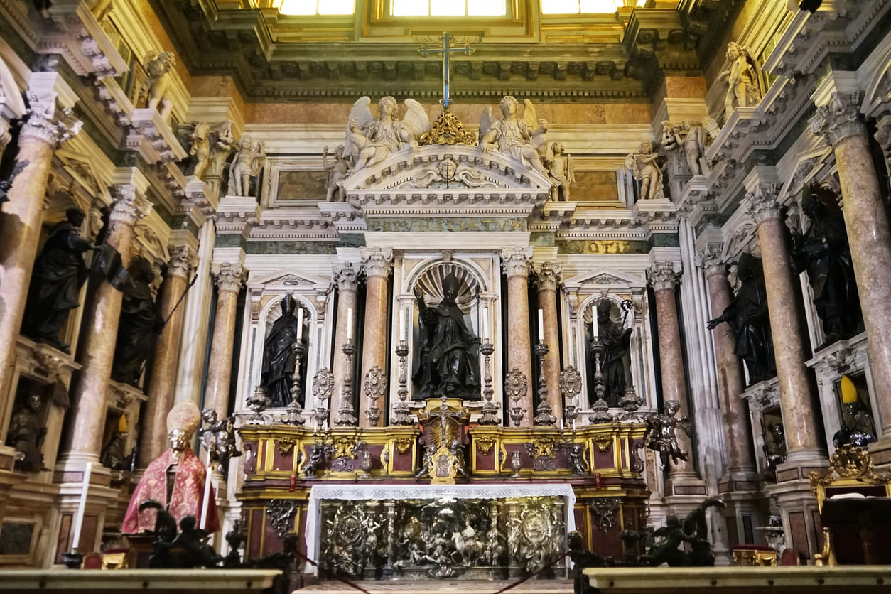 The interior of Naples Cathedral features statues and an ornate altar dedicated to Saint Januarius, the city's beloved patron saint.