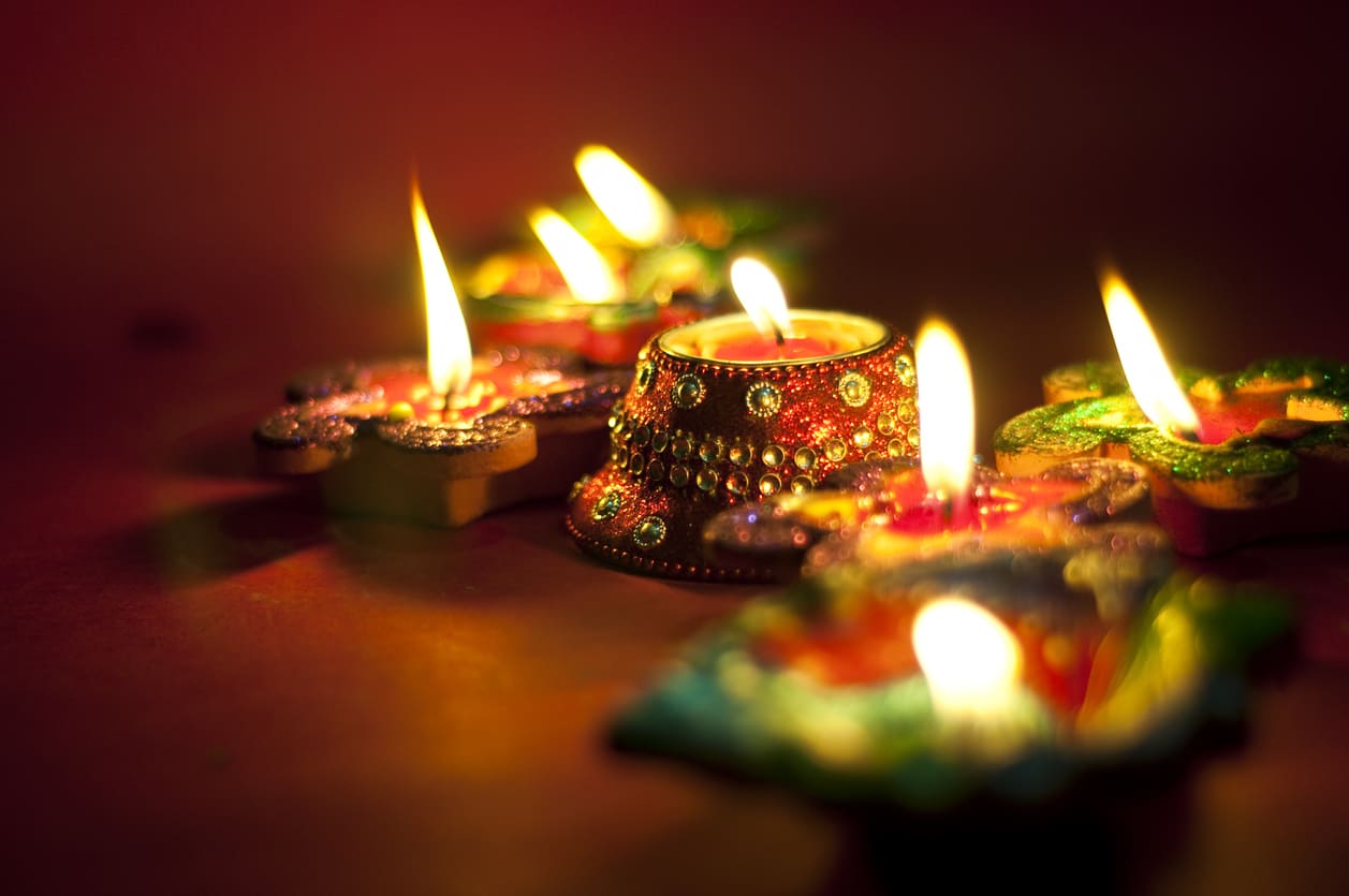 Vibrant, decorative diyas glowing brightly, representing the festive spirit of Diwali.