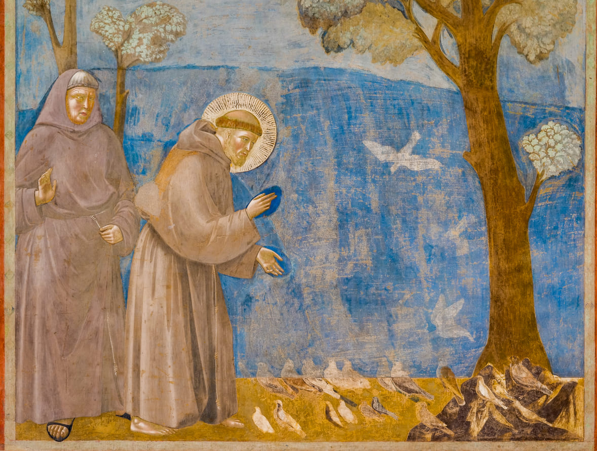 Fresco depicting St. Francis of Assisi preaching to birds, symbolizing his deep connection with nature and all living creatures.