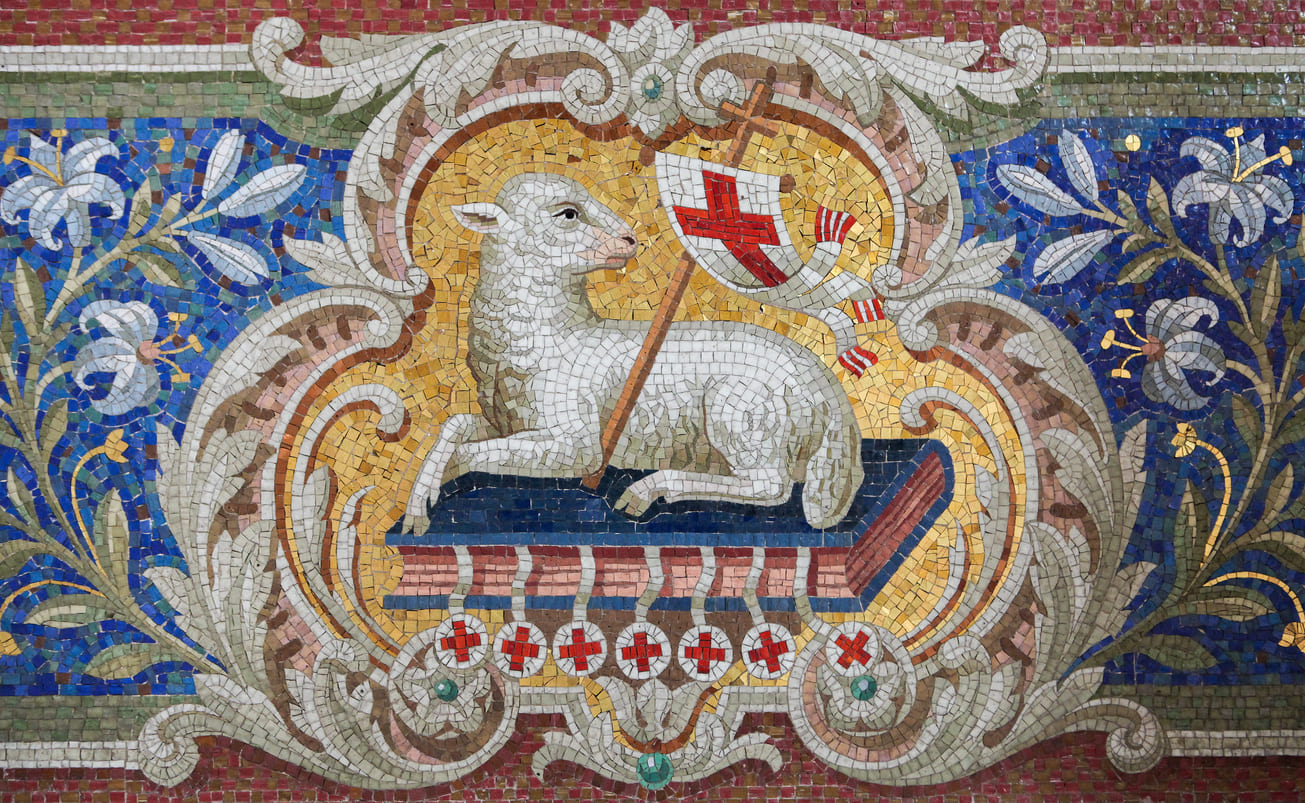 A detailed mosaic depicts the Lamb of God holding a cross and banner, representing Jesus' sacrifice and the promise of resurrection.