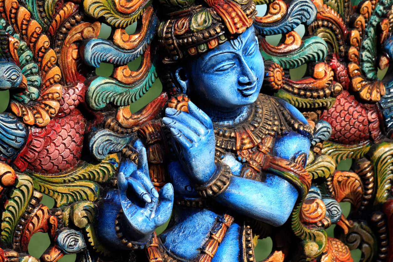 A vibrant statue of Lord Krishna, capturing his divine and playful essence.