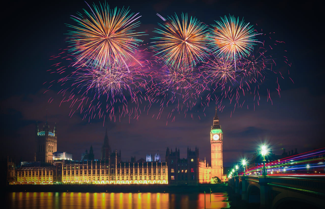 Fireworks burst over Big Ben and the Houses of Parliament, celebrating the arrival of the New Year in London.