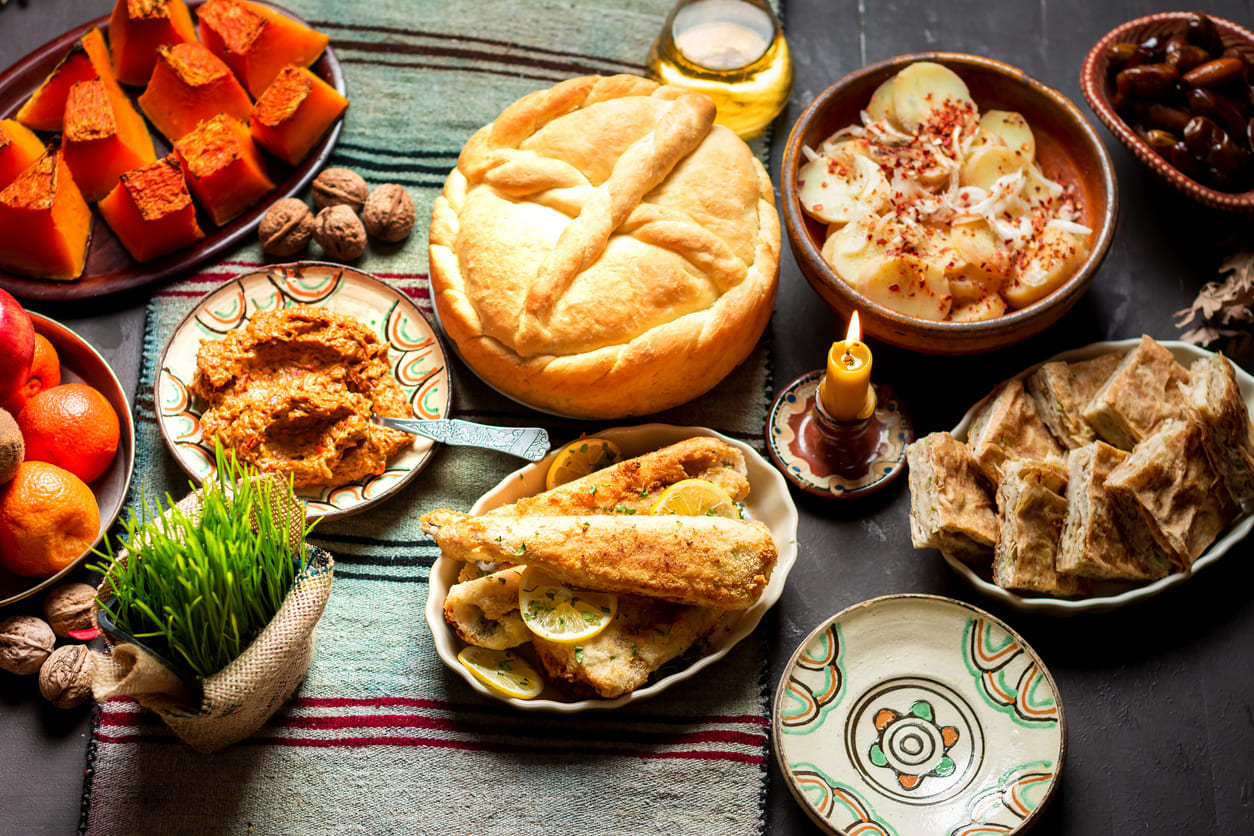 A traditional Orthodox Christmas meal with festive bread, fried fish, baked vegetables, and seasonal dishes, symbolizing faith and togetherness.