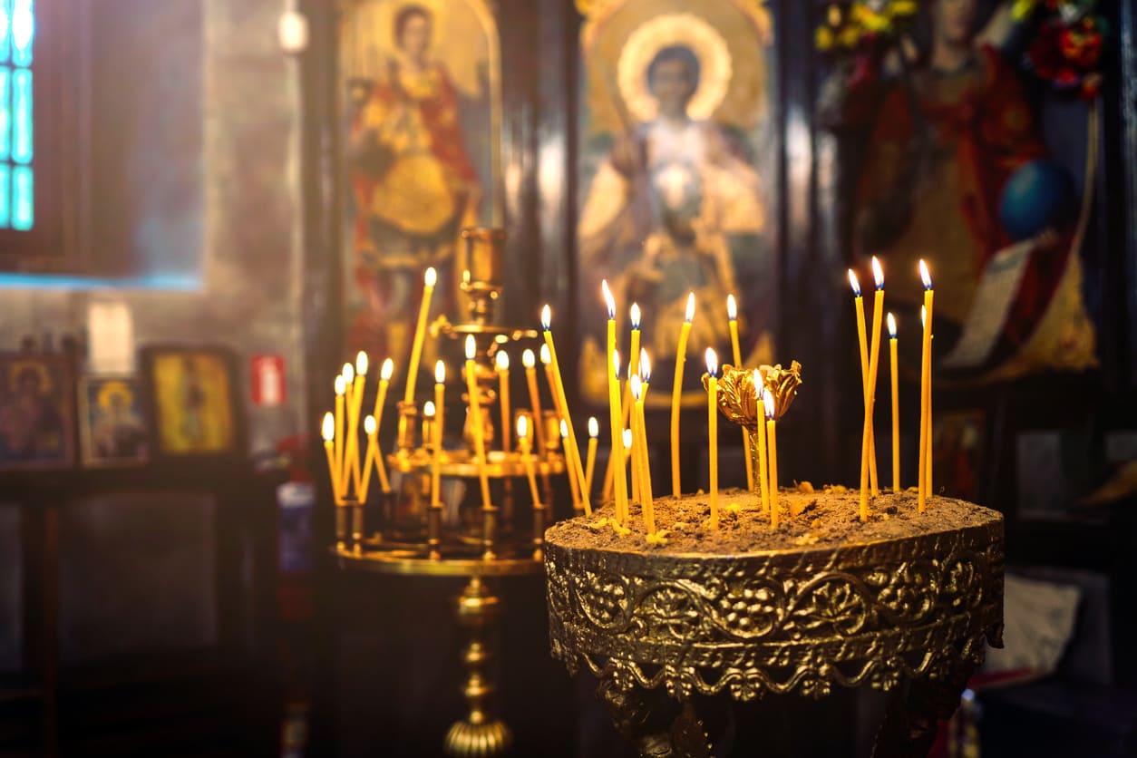 Lit candles in an Orthodox church, representing prayers and spiritual reflection for the Orthodox New Year.