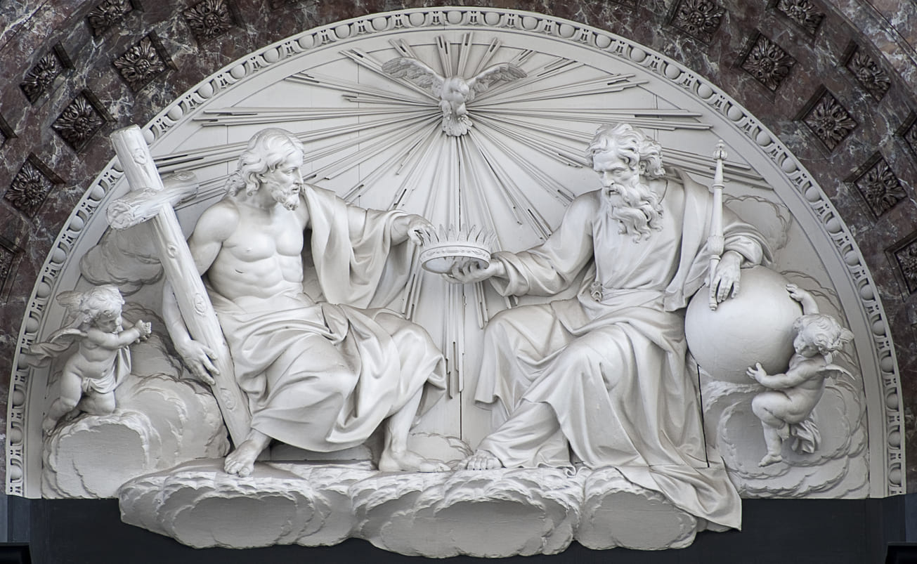 A sculpture of the Holy Trinity, depicting God the Father, Jesus Christ, and the Holy Spirit as a dove.