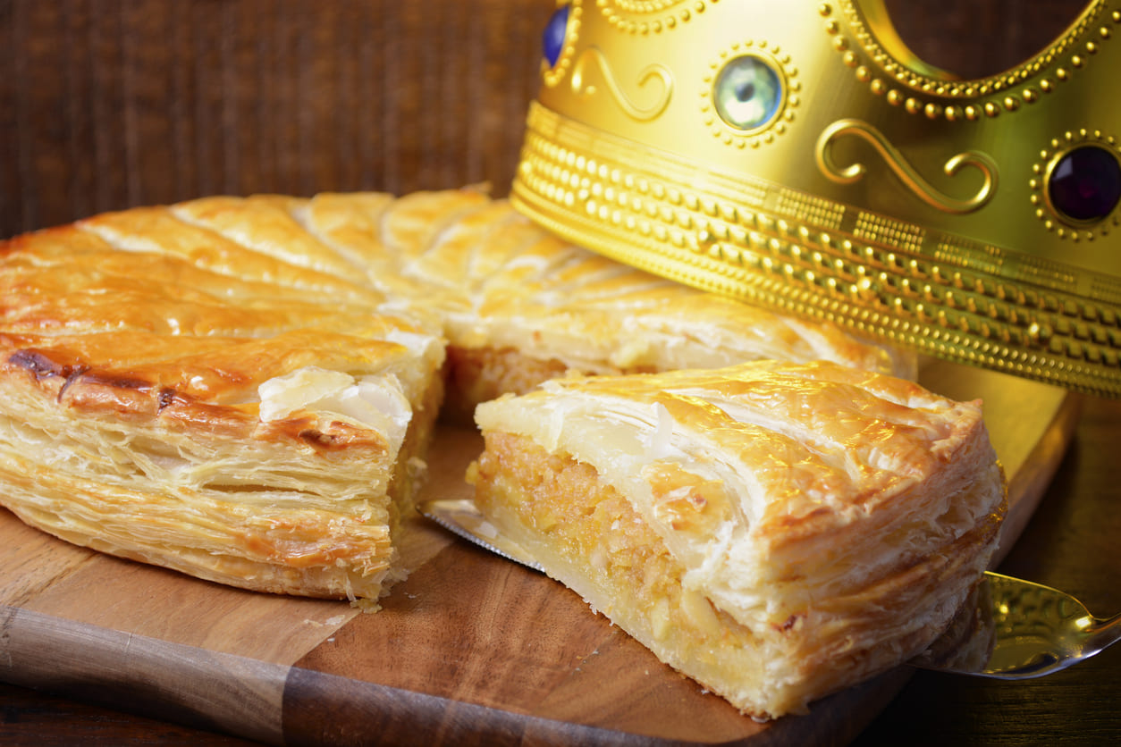 A golden Twelfth Night cake with a crown, symbolizing festive celebrations for the end of Christmas and Epiphany.