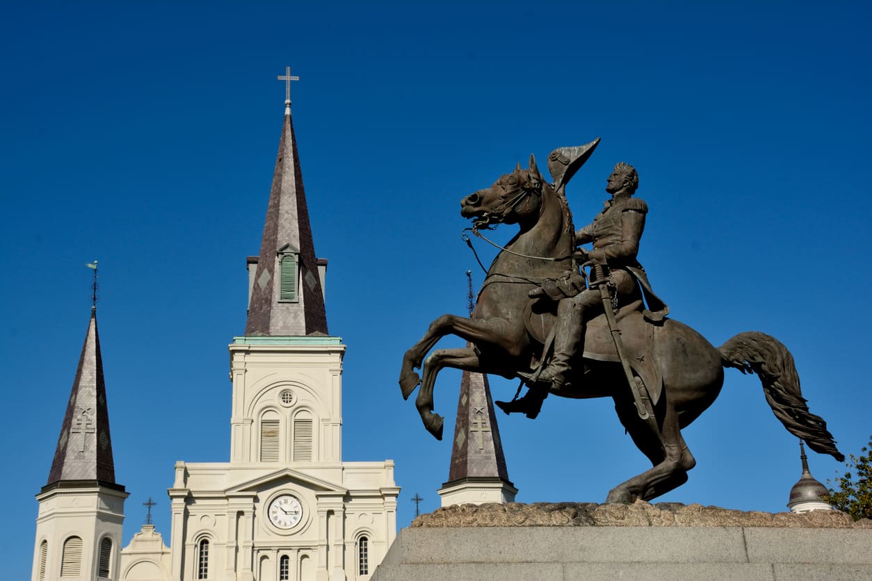 The statue of Andrew Jackson on horseback stands proudly in Jackson Square, framed by the iconic St. Louis Cathedral.