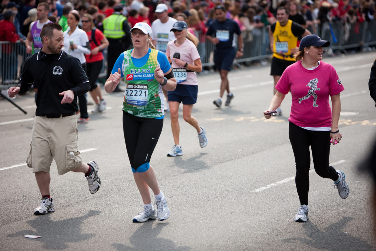 Runners near Kenmore Square approach the final stretch of the Boston Marathon.