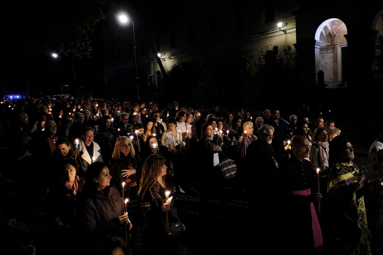 Candlelit procession of worshipers during an Orthodox Holy Saturday service, symbolizing prayer and anticipation of Easter.