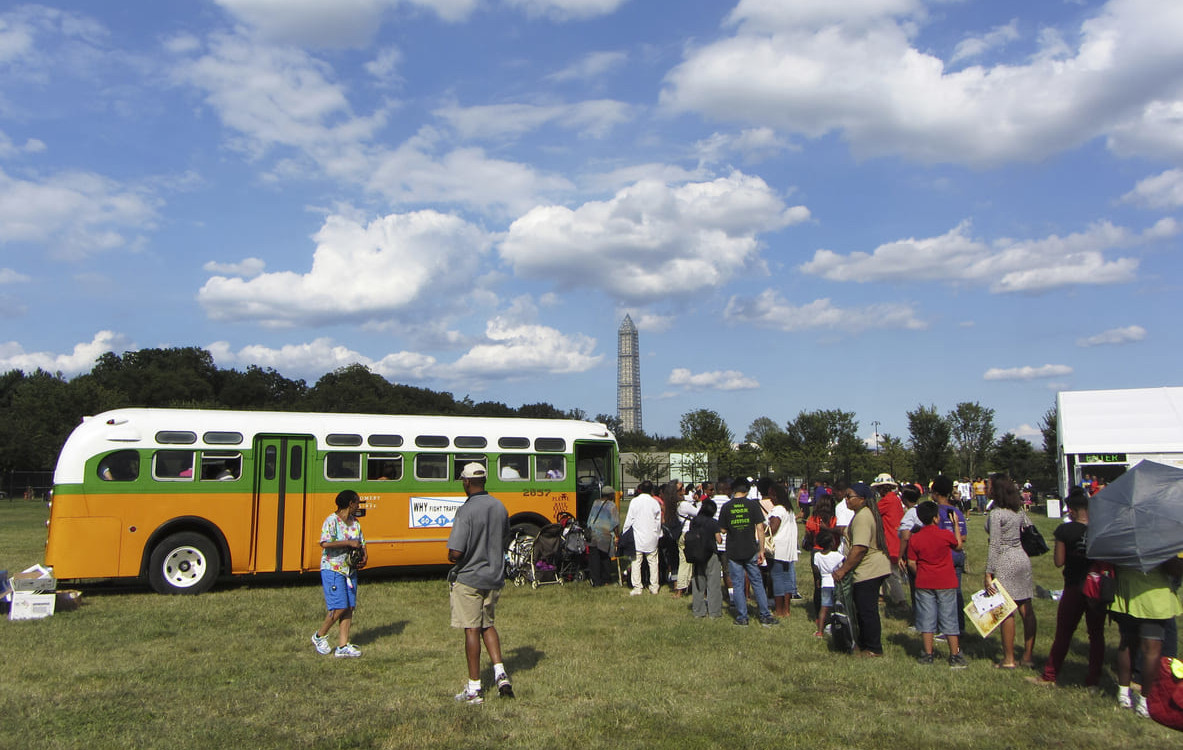 Visitors gather around a restored Rosa Parks bus, commemorating the 50th anniversary of the Civil Rights March.