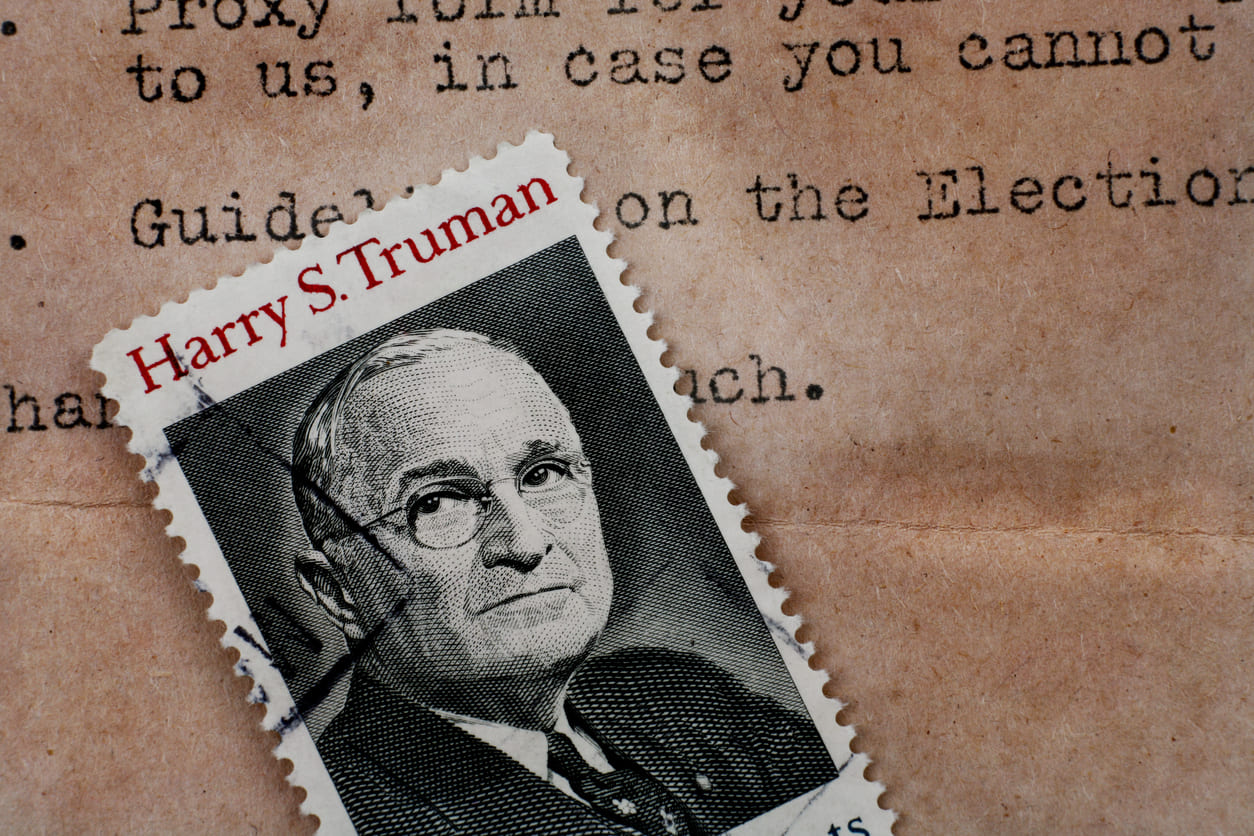 A vintage Harry S. Truman postage stamp, symbolizing his historical legacy.